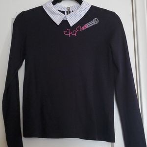 Black top with polka dot collar